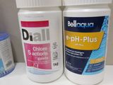 two bottles of pills sitting on a counter next to each other
