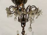 an image of a chandelier made of metal and glass