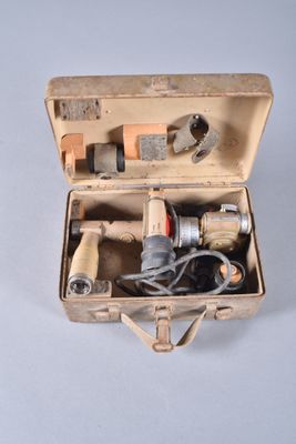 a tool in a case that is sitting on a table