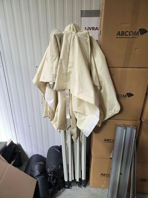 a pile of boxes and umbrellas on the floor