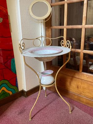 a small table with a mirror on top of it