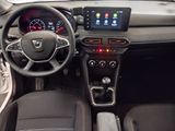 the interior of a car with a steering wheel, dashboard, and dashboard controls