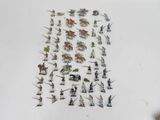 many figurines of different types and sizes on the table