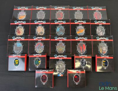 a lot of badges that are on display on a table