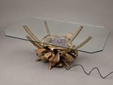 a glass table with a metal object on it