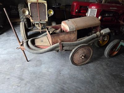 a small toy car that is sitting in a garage