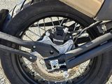 a motorcycle that is parked on the side of the road