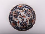 an image of a blue and white bowl with flowers and birds on it