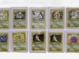 a close up of a bunch of pokemon cards on a table
