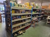 many shelves of paint and other items in the store