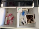a white box with a lot of items inside of it
