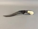 an image of a knife with a handle on a table