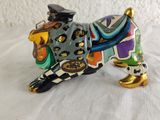 a figurine of a dog with a hat on it ' s head