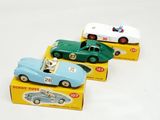 three toy cars that are sitting on top of each other