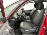 the interior of a red car with the door open