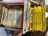a box full of children ' s books sitting on a table