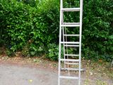 a ladder that is standing in the middle of the road