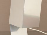 a lamp that is sitting on a table with a mouse