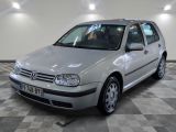a silver car that is parked on a checkered floor