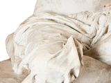 a statue of a woman laying on top of a table
