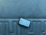 the back seat of a car with a small piece of plastic on it