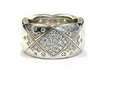 a close up of a diamond ring on a white background