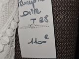 a label on a piece of luggage that is hanging on a wall