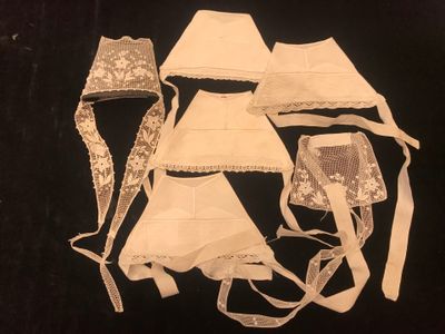 several pieces of clothing are laid out on a black surface