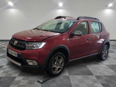 the red dacia is parked on a checkered tile floor