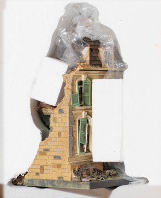 a picture of a doll house in a plastic bag