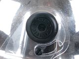 a close up of a car ' s front wheel with a plastic cover