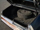 a hat in the trunk of a car with its hood open