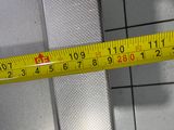 a measuring tape that is on the wall of a bathroom
