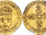 a gold coin with a crown on the front and a shield on the back