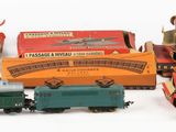 a lot of small toy trains sitting on a white surface