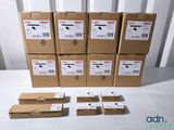 several boxes of electronic equipment sitting on top of a white table