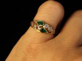 a close up of a person ' s hand with a ring on it