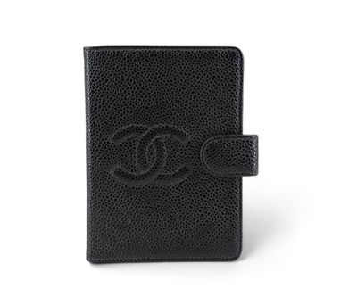 a black leather passport case with a logo on the front