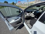 a white car with its door open on the side of the road
