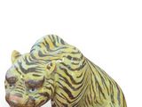 a statue of a tiger that is sitting on the ground