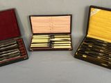 three different types of pens are in a case on a table