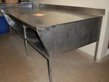 a large metal table in the middle of a room