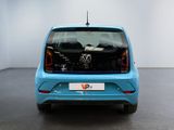 a blue car that is parked in a room