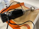 a black and silver electric blender sitting on a tray