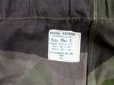a label on the back of a camouflage jacket