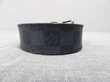 black leather belt with silver buckle on a white background