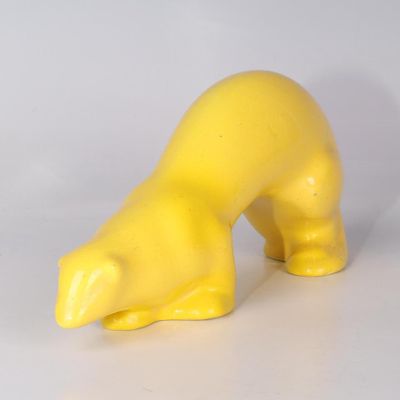 PRIMAVERA. Loutre Art Déco en faïence à couverte jaune.
