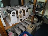 many different machines on a shelf in a room