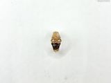 an image of a gold ring on a white surface