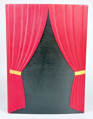 a picture of a red and black book with a red curtain